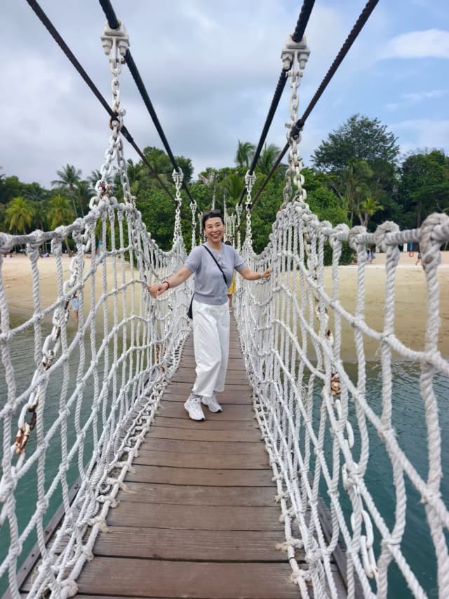 Cross the suspension bridge to the 'Southernmost Point of Continental Asia,' where a four-story viewing tower offers panoramic views of the islet and the massive cargo ships in the Strait of Malacca.