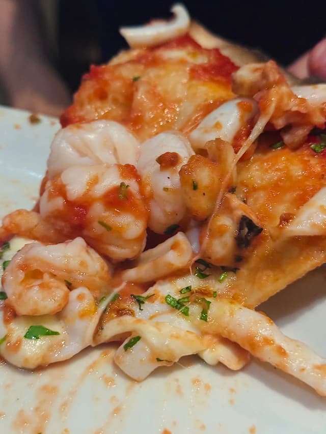 Moretti's red sauce pizza, with its authentic Italian taste and wood-fired aroma, is a chill spot in Leichhardt perfect for a relaxed meal and a stroll.