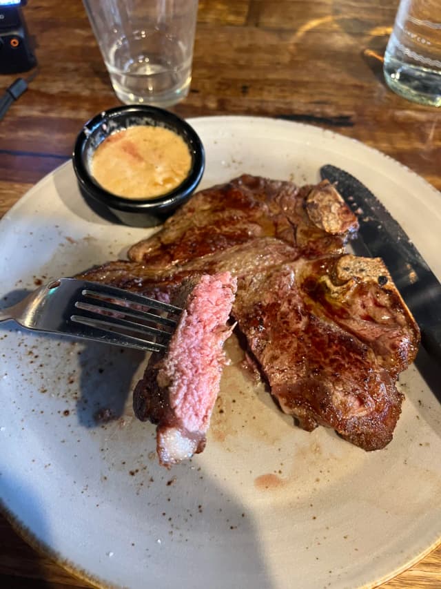 Try the T-bone steak at Macelleria Newtown cooked medium-rare – it's perfectly tender and pairs beautifully with sea salt and an amazing mushroom sauce!