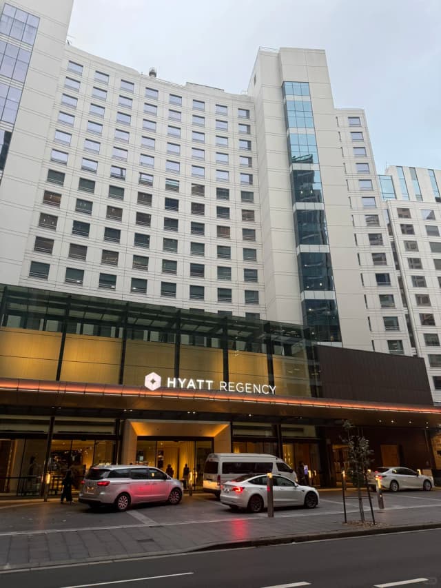 Trying the signature 'Sydney Sunset' cocktail while watching the sunset at Darling Harbour from the Hyatt Regency Sydney lounge is a must-do experience.