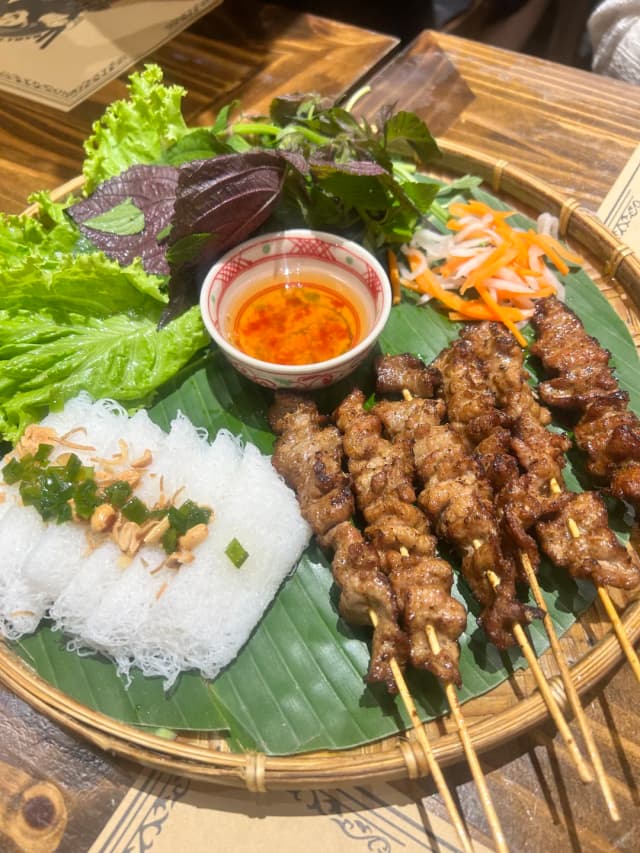 At Michelin-recommended Bếp Mẹ Ỉn, the grilled meat vermicelli wrapped in perilla leaves is simply art.
