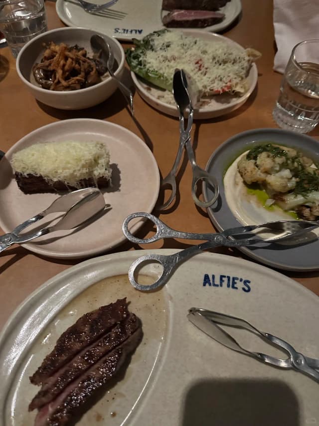 Alfie's $39 sirloin steak is perfectly charred and juicy, with the Potato Rosti being a must-try side dish!