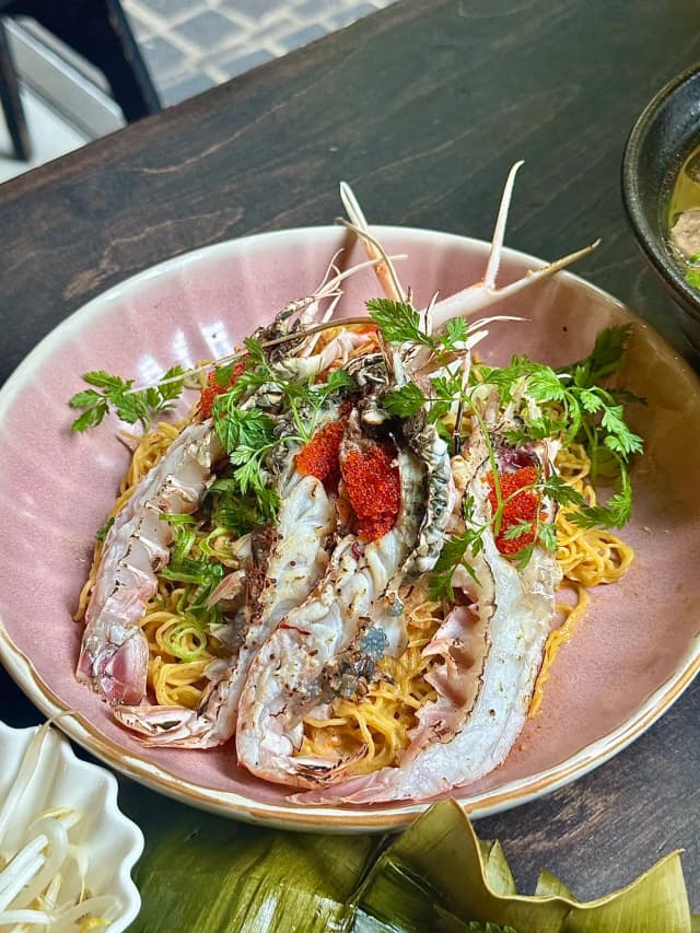 The Aburi Scampi Noodle is a standout dish with sweet New Zealand scampi, rice noodles, topped with fish roe and a rich X.O. coconut butter and chilli sauce!